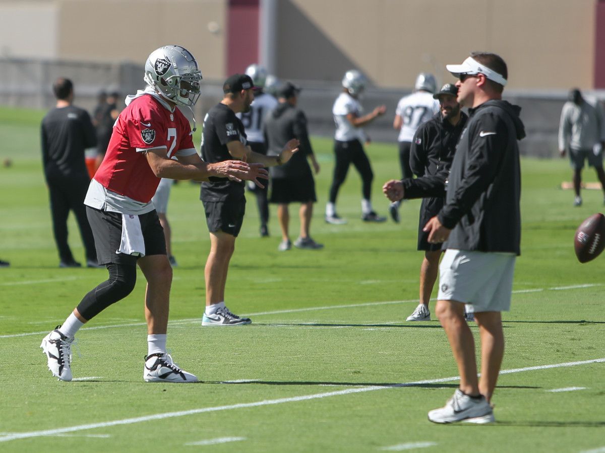 Josh McDaniels and Brian Hoyer talking during practice earlier this week.