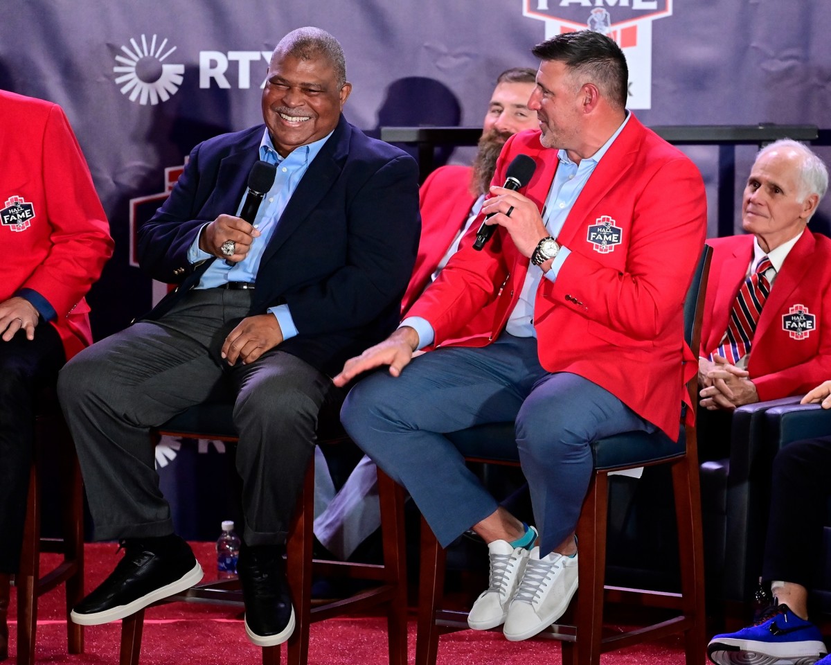 Former New England Patriots defensive coordinator Romeo Crennel (left) tells a story about 2023 Patriots Hall of Fame inductee Mike Vrabel (right) on Saturday night in Foxborough, Mass. (Eric Canha-USA TODAY Sports)