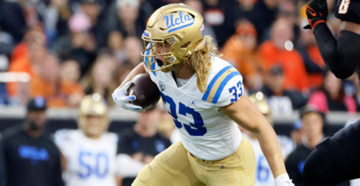 UCLA Bruins running back Carson Steele on a rushing attempt during a college football game.
