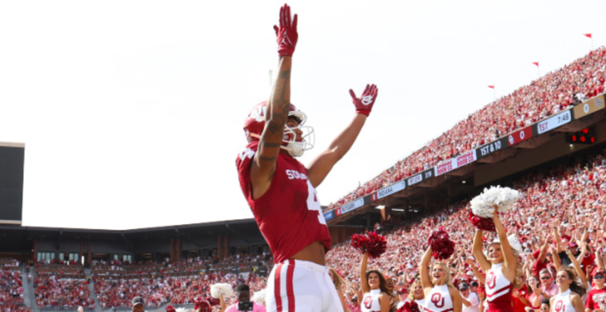 Oklahoma Sooners wide receiver Nic Anderson celebrates a touchdown during a college football game.