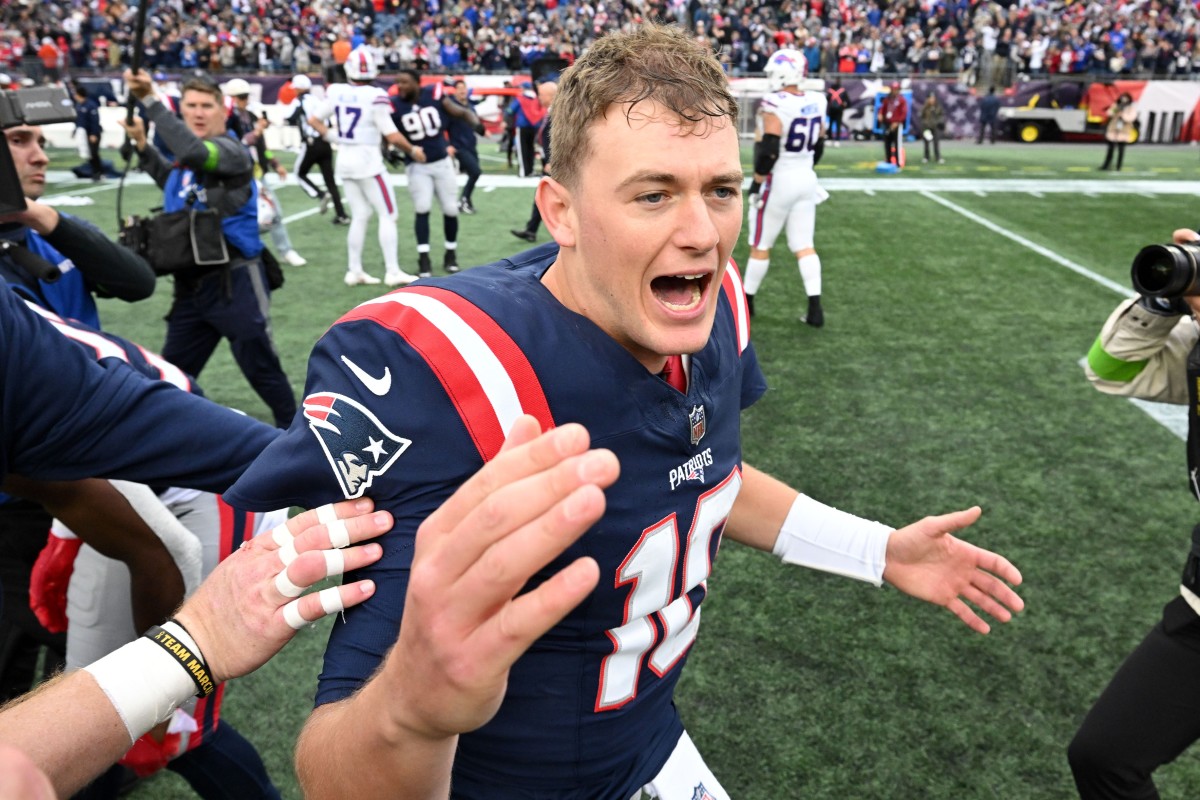 Patriots quarterback Mac Jones celebrates after New England's 29-25 upset win of the Bills in Week 7.