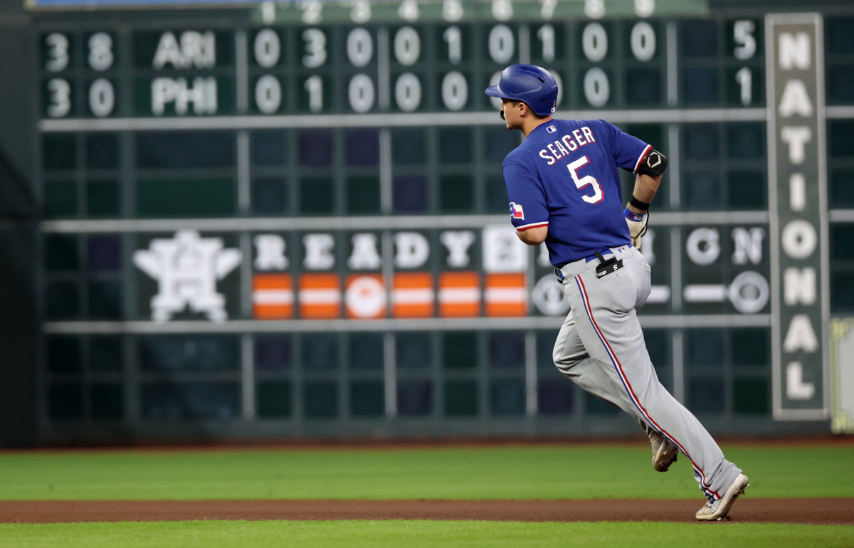 Oct 23, 2023; Houston, Texas, USA; Texas Rangers shortstop Corey Seager (5) rounds the bases after hitting a home run during the first inning of game seven in the ALCS against the Houston Astros for the 2023 MLB playoffs at Minute Maid Park. Mandatory Credit: Erik Williams-USA TODAY Sports
