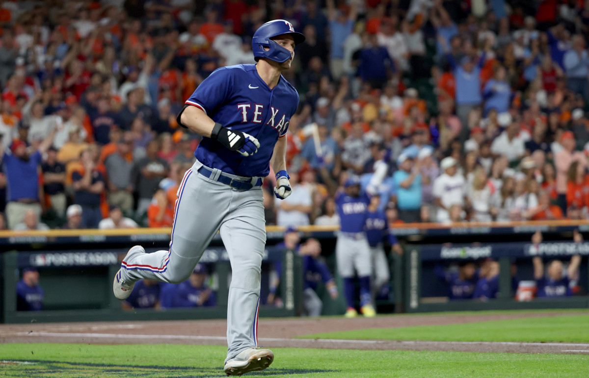 Oct 23, 2023; Houston, Texas, USA; Texas Rangers shortstop Corey Seager (5) hits a home run during the first inning of game seven in the ALCS against the Houston Astros for the 2023 MLB playoffs at Minute Maid Park. Mandatory Credit: Erik Williams-USA TODAY Sports