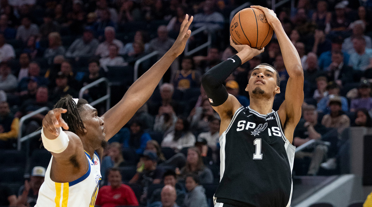 Spurs’ Victor Wembanyama takes a jump shot vs. the Warriors in an NBA preseason game.