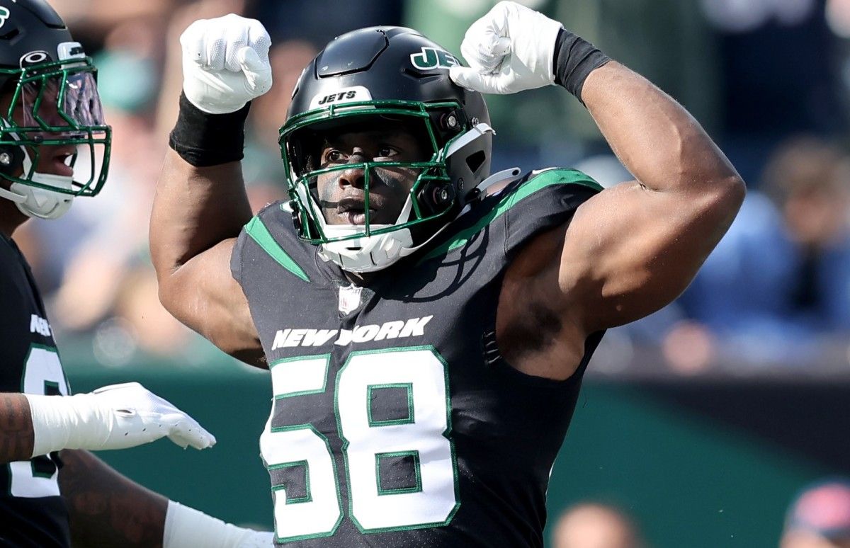 New York Jets defensive end Carl Lawson (58) reacts after a sack during the first quarter against the New England Patriots at MetLife Stadium.
