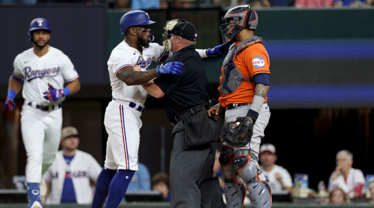 Rangers right fielder Adolis García yells at Astros catcher Martín Maldonado during Game 5 of the ALCS on Oct. 20, 2023.