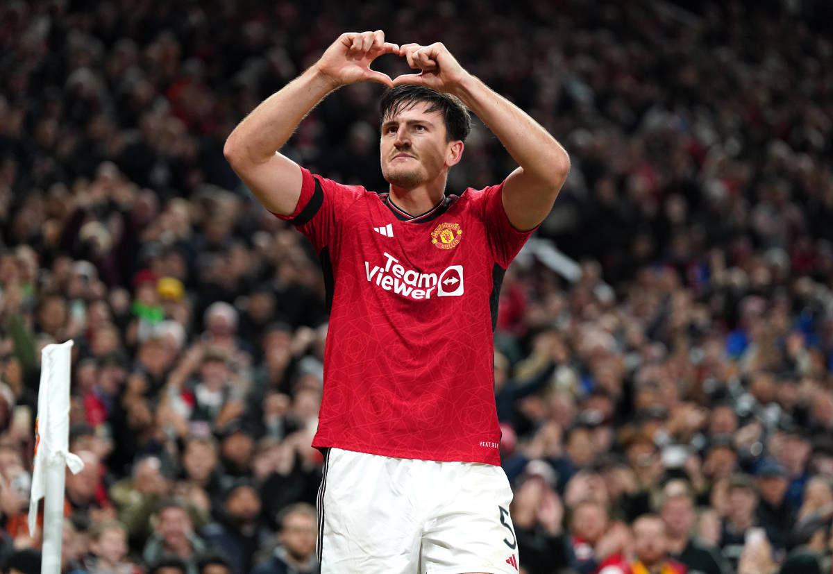 Harry Maguire pictured aiming a heart gesture towards Manchester United fans after scoring a goal in a 1-0 win over Copenhagen in the UEFA Champions League in October 2023