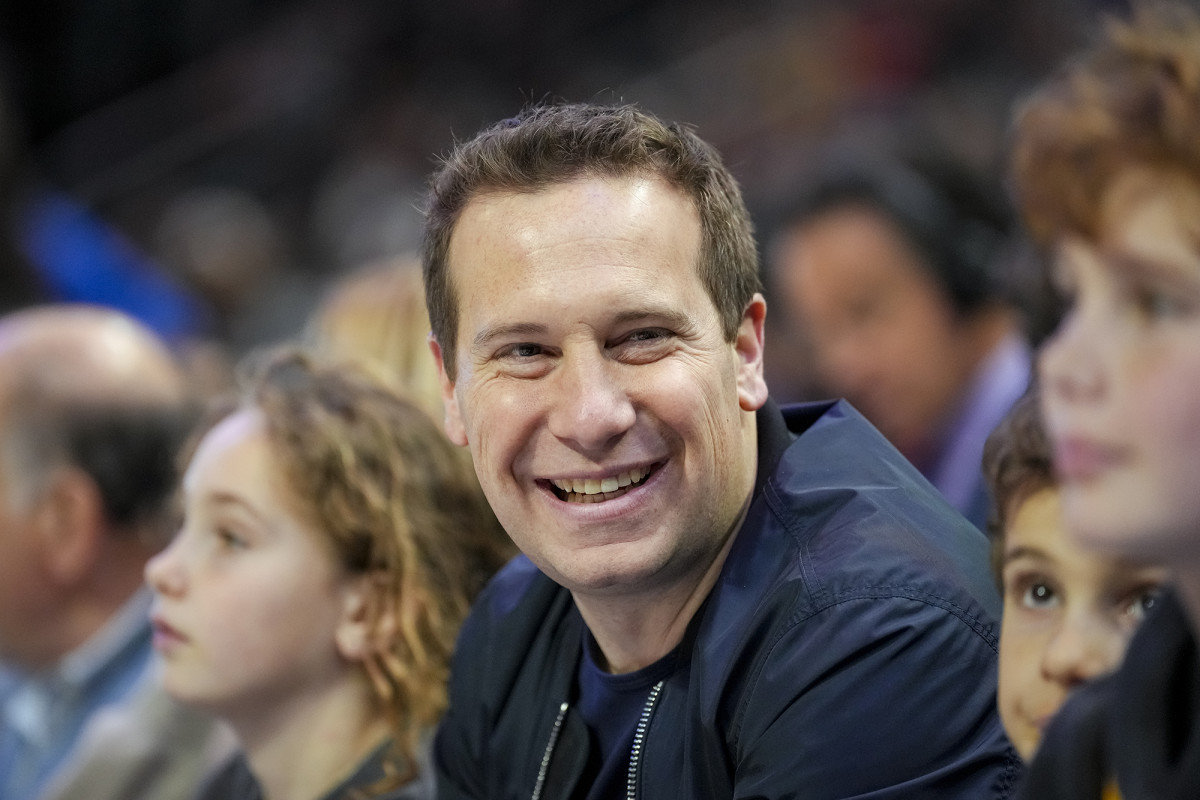 Suns owner Mat Ishbia smiles while attending a game.