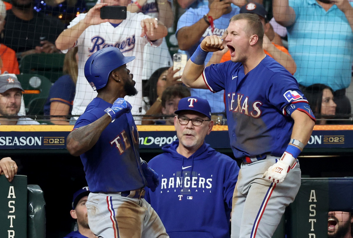 Texas Rangers right fielder Adolis Garcia celebrates with third baseman Josh Jung after hitting a home run during the third inning of Game 7 in the ALCS against the Houston Astros.