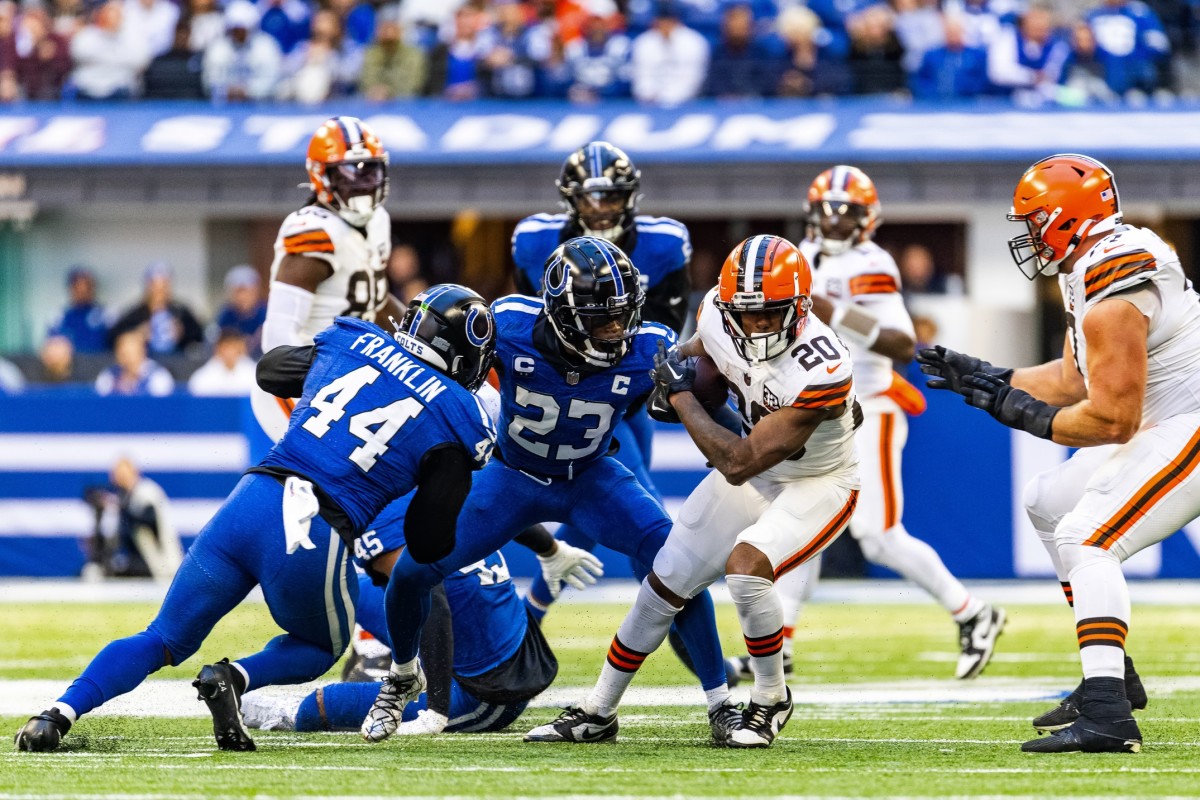 Oct 22, 2023; Cleveland Browns running back Pierre Strong Jr. (20) is stopped by Indianapolis Colts linebacker Zaire Franklin (44) and cornerback Kenny Moore II (23). Mandatory Credit: Trevor Ruszkowski-USA TODAY