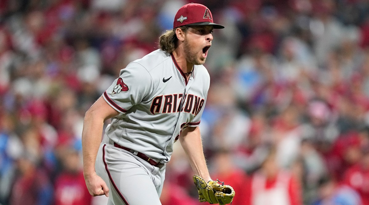 Diamondbacks relief pitcher Kevin Ginkel celebrates after the last out in the ninth inning in Game 7 of the NLCS against the Phillies.