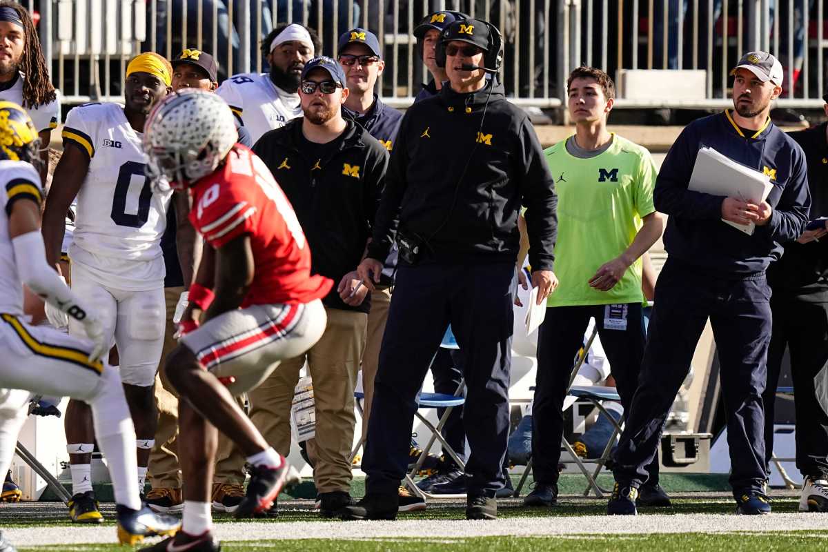 Connor Stalions standing on the Michigan football sideline.