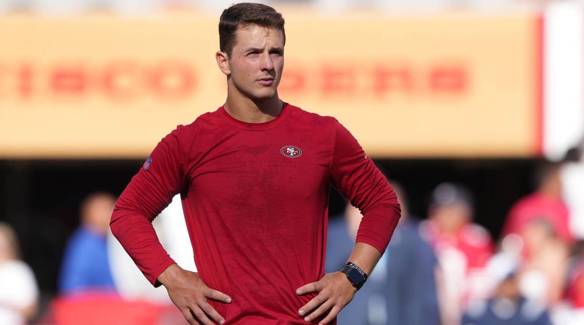 49ers quarterback Brock Purdy looks on during warmups before a game.