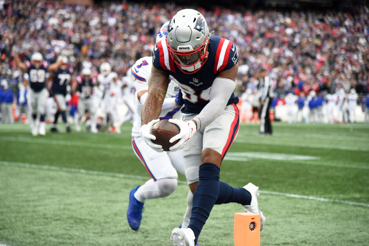 Kendrick Bourne leans with the ball in two hands, reaching over into the endzone