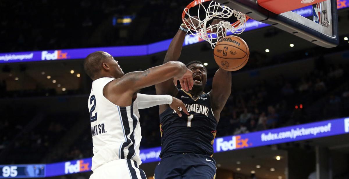 New Orleans Pelicans forward Zion Williamson dunks over Memphis Grizzlies forward Xavier Tillman during the second half at FedExForum. Mandatory Credit:
