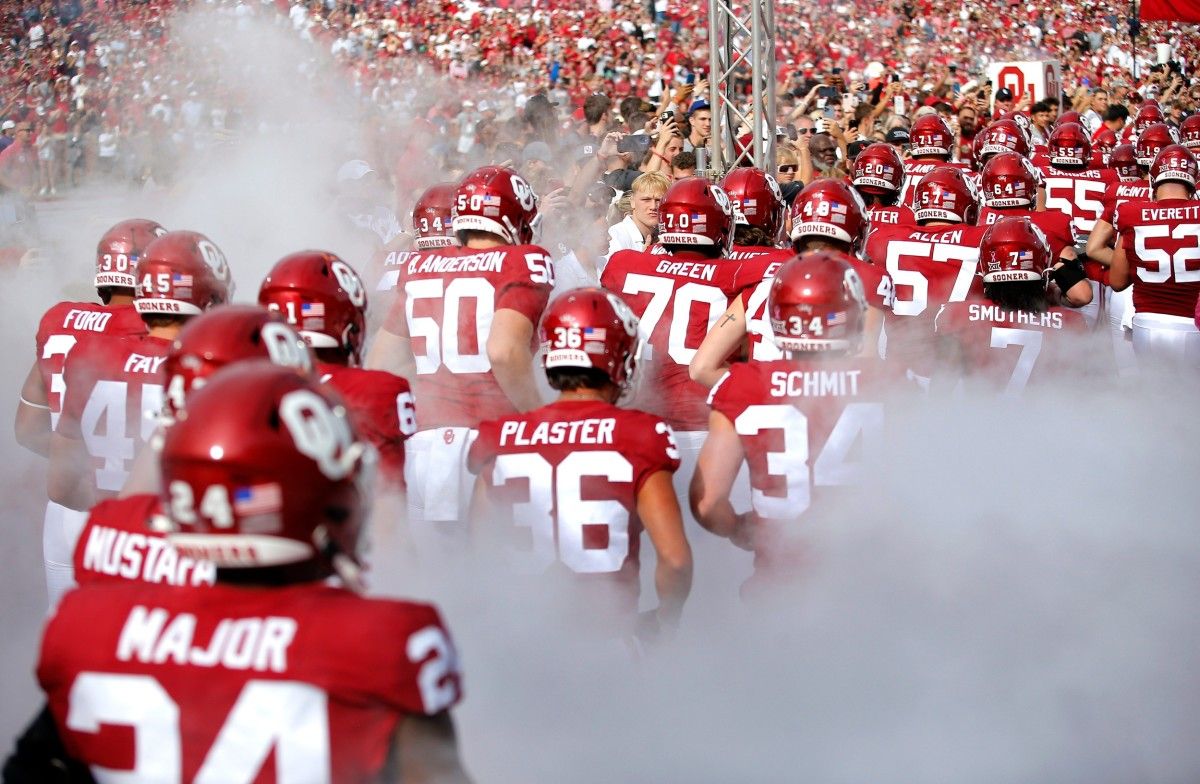Oklahoma runs on to the field before the college football game between the University of Oklahoma Sooners and the University of Central Florida Knights at Gaylord Family Oklahoma-Memorial Stadium in Norman, Okla., Saturday, Oct., 21, 2023.
