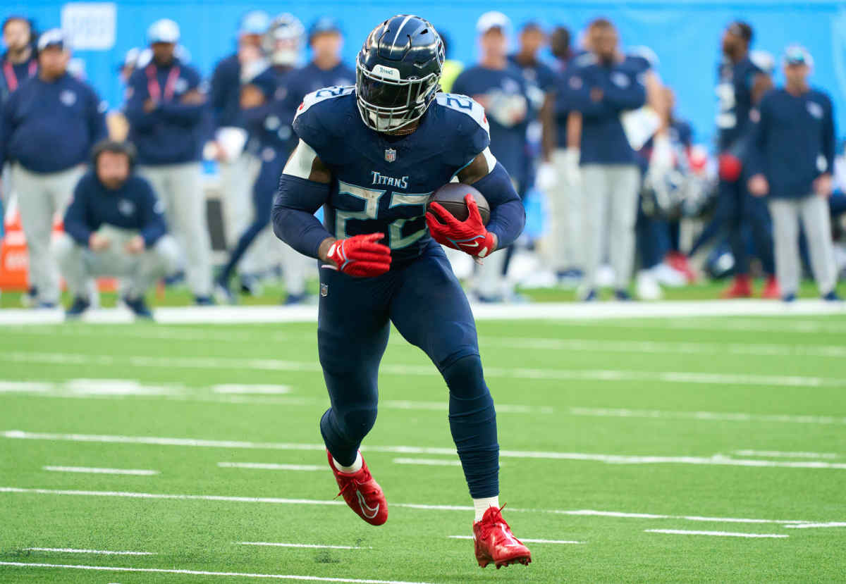 Oct 15, 2023; London, United Kingdom; Tennessee Titans running back Derrick Henry (22) runs in for a touchdown during the second half of an NFL International Series game at Tottenham Hotspur Stadium. 