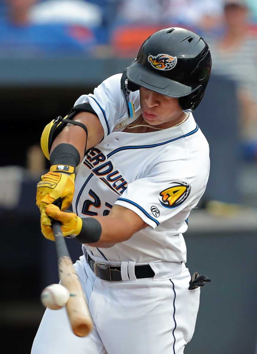 Akron RubberDucks second baseman Juan Brito doubles to right field against the Richmond Flying Squirrels during the first inning of a Minor League Baseball game at Canal Park, Thursday, July 20, 2023, in Akron, Ohio.