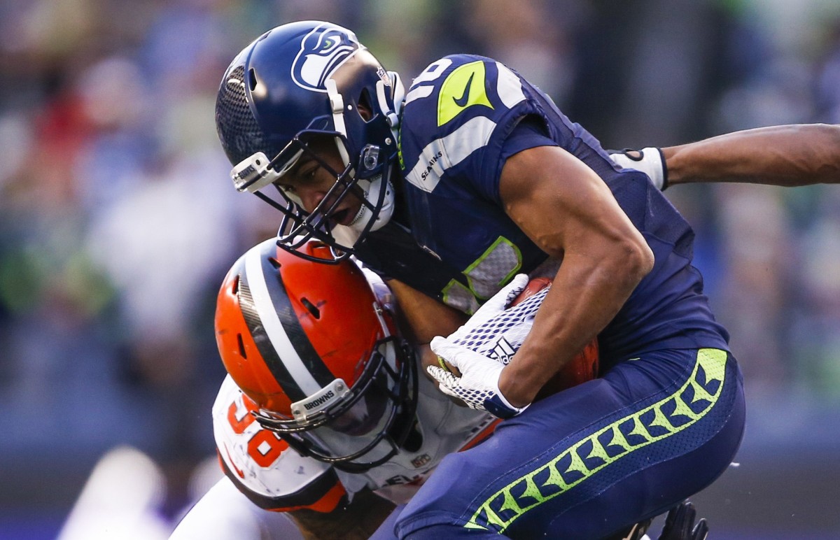 Seattle Seahawks wide receiver Tyler Lockett (16) is tackled on a kickoff return by Cleveland Browns defensive tackle Jamie Meder (98) during the fourth quarter at CenturyLink Field.