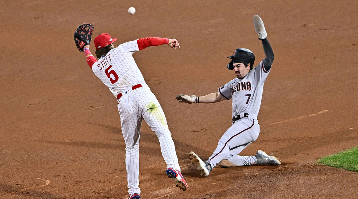 Diamondbacks’ Corbin Carroll steals second base vs. the Phillies in the NLCS.