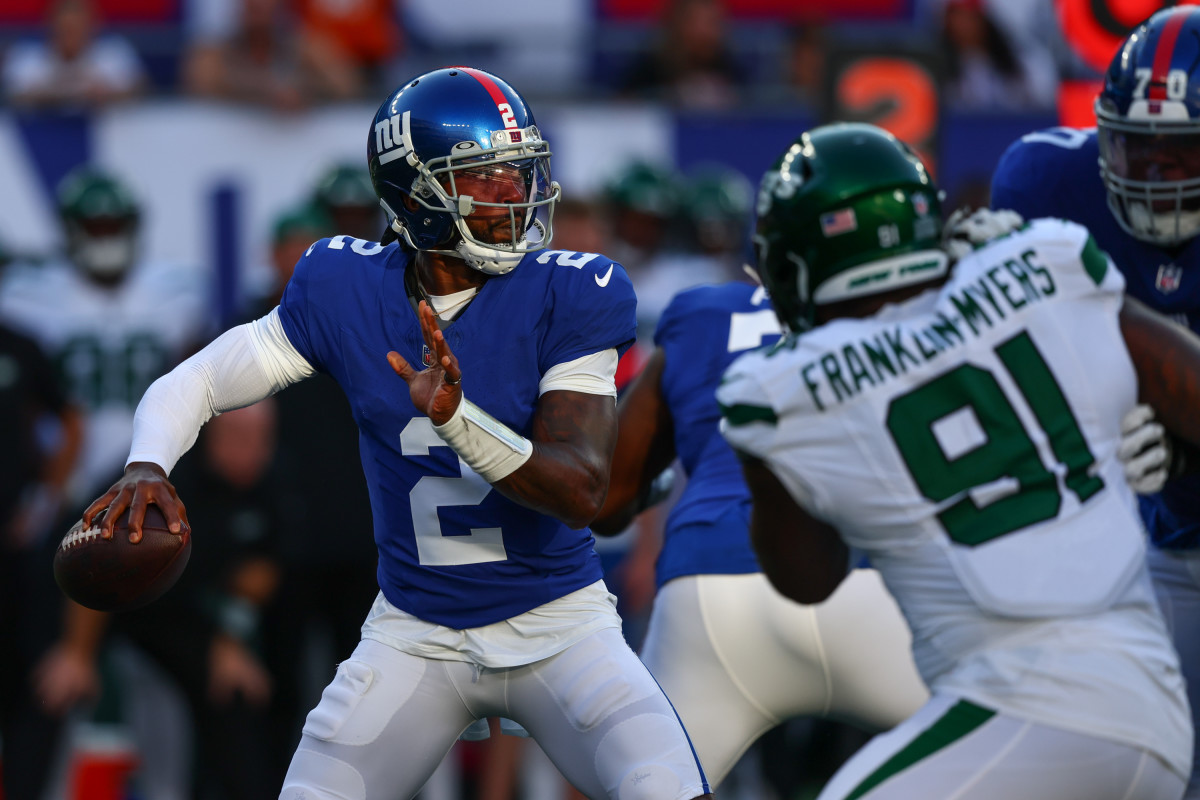 Giants' QB Tyrod Taylor (2) winds up to throw against the Jets