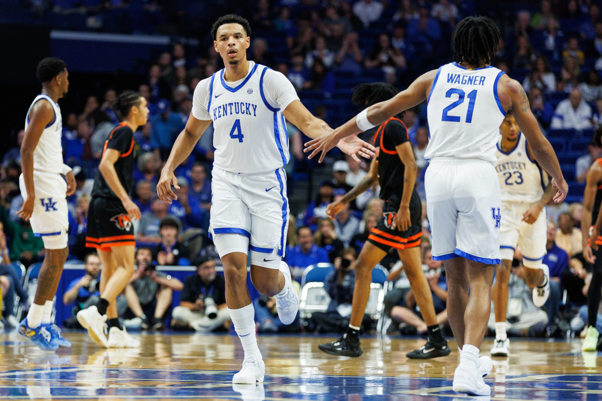Oct 27, 2023; Lexington, KY, USA; Kentucky Wildcats forward Tre Mitchell (4) greets guard D.J. Wagner (21) during the first half against the Georgetown Tigers at Rupp Arena. Mandatory Credit: Jordan Prather-USA TODAY Sports