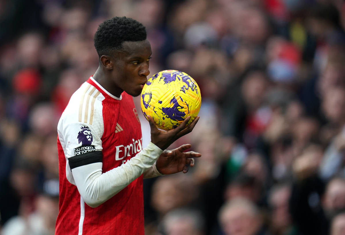 Eddie Nketiah pictured kissing the match ball after scoring a hat-trick for Arsenal against Sheffield United in October 2023
