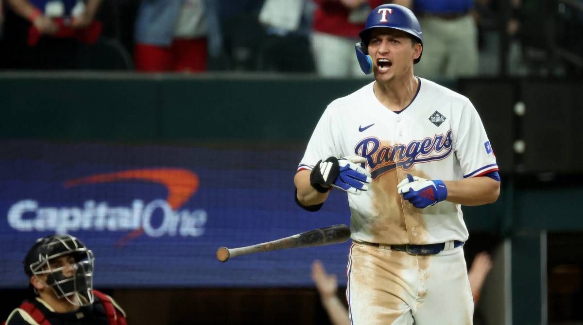 Rangers shortstop Corey Seager screams after hitting a home run in Game 1 of the 2023 World Series.