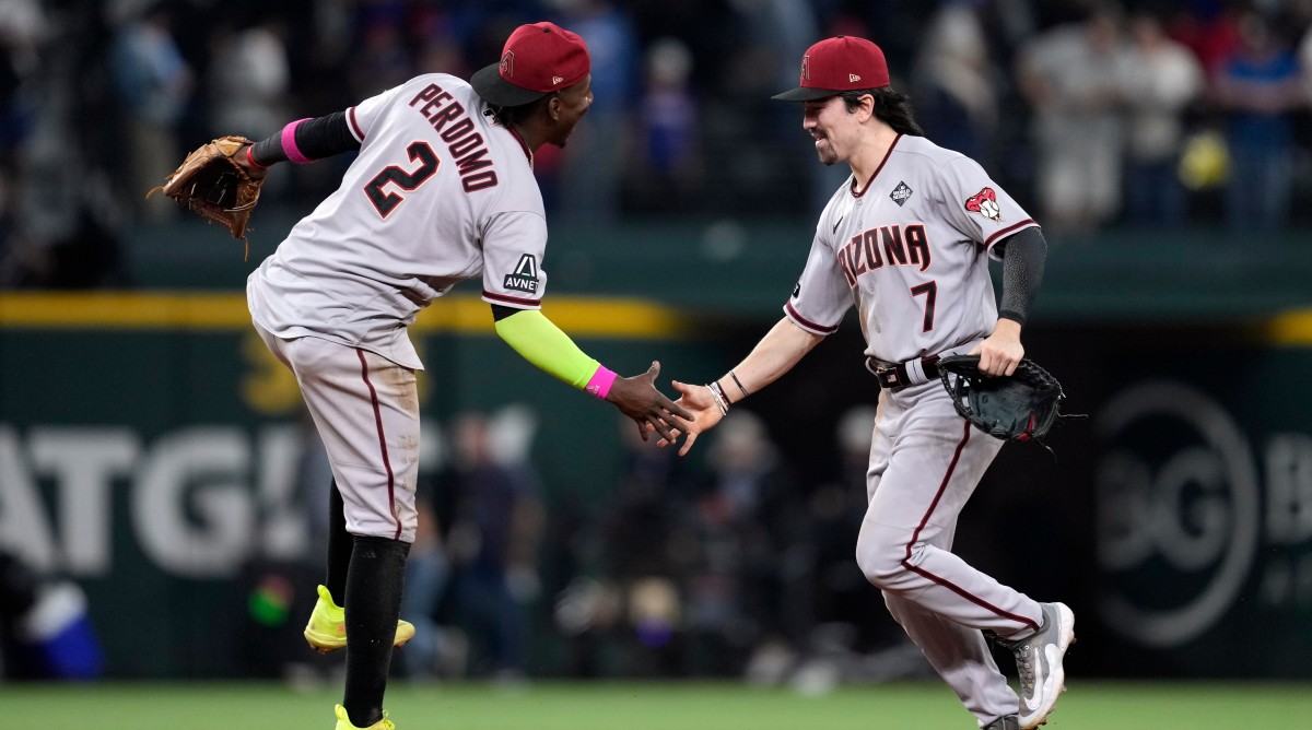 Diamondbacks players Geraldo Perdomo (2) and Corbin Carroll (7) celebrate after Game 2 of the World Series.