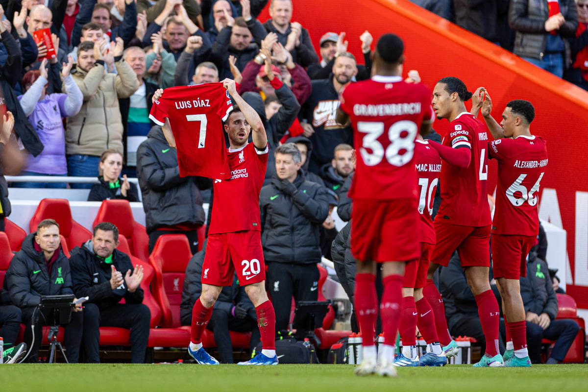 Diogo Jota pictured holding up a Liverpool jersey printed with the name of Luis Diaz during a Premier League game against Nottingham Forest in October 2023. Diaz had missed the game after his parents were kidnapped in Colombia.