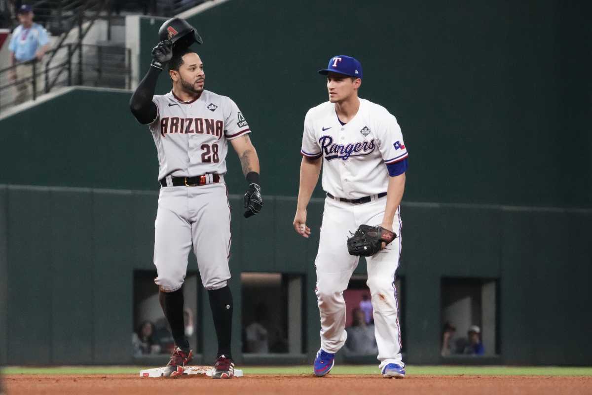 Texas Rangers shortstop Corey Seager looks on after tagging out Arizona Diamondbacks designated hitter Tommy Pham at second base during the sixth inning in Game 2 of the 2023 World Series at Globe Life Field.