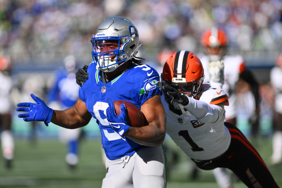 Seattle Seahawks running back Kenneth Walker III (9) carries the ball while Cleveland Browns safety Juan Thornhill (1) chases during the first half at Lumen Field.