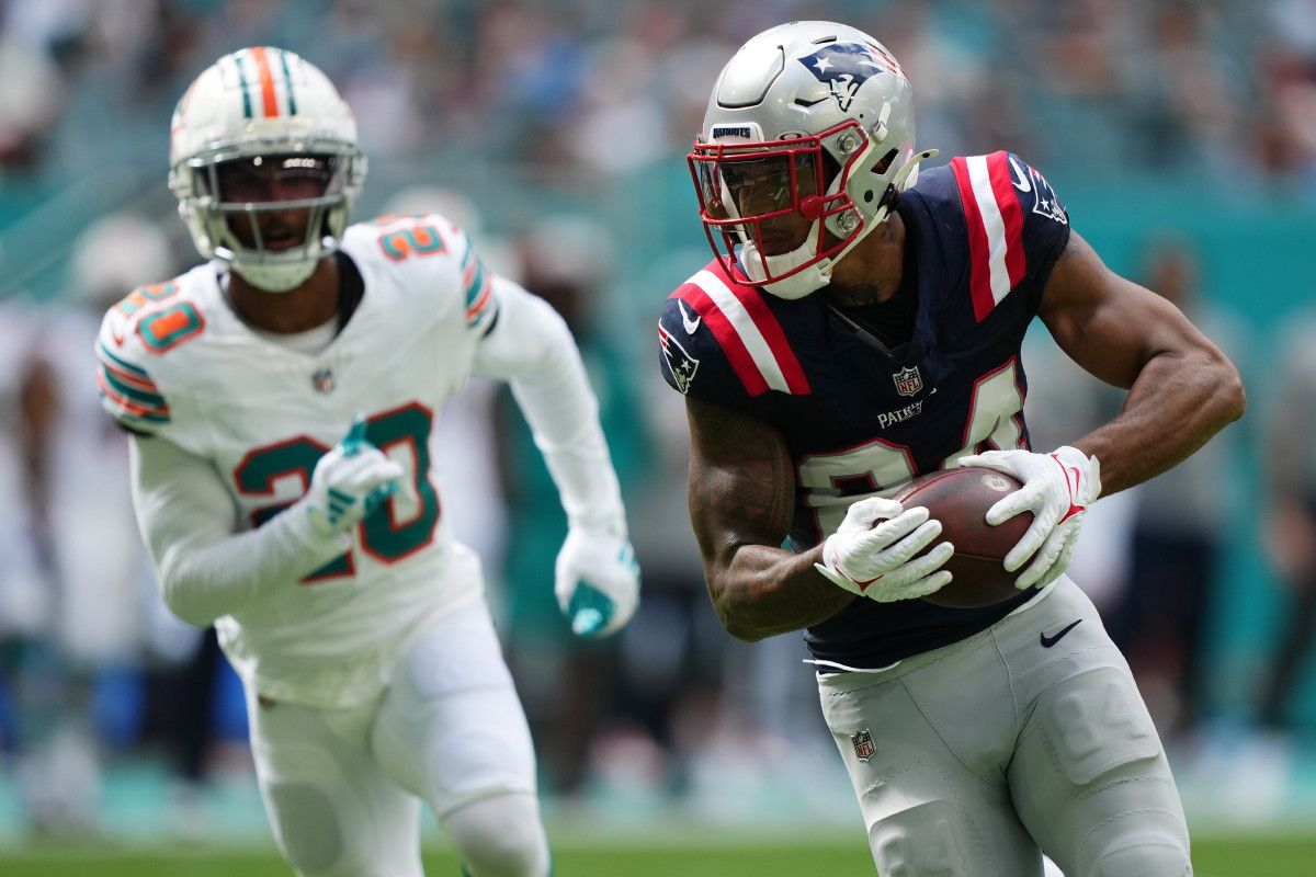 New England Patriots wide receiver Kendrick Bourne (84) runs the ball for a touchdown against the Miami Dolphins during the first half at Hard Rock Stadium.