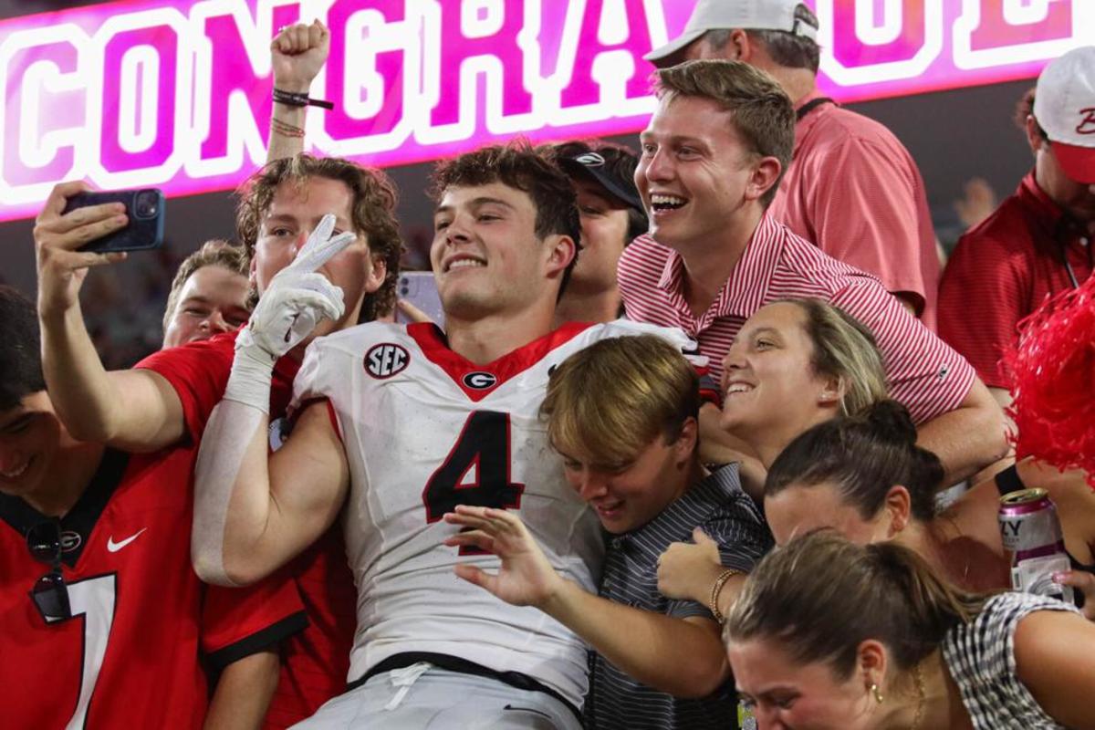 Georgia TE Oscar Delp being mobbed by Bulldog Nation during the second half of Georgia v. Florida, Oct. 28, 2023. (Photo Credits: Landen Todd from The Red and Black)