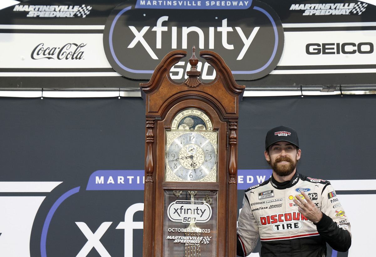 Ryan Blaney celebrates with the traditional grandfather's clock awarded to race winners at Martinsville Speedway after winning Sunday's NASCAR Cup Series Xfinity 500. sending him to the Championship 4 title-deciding race next Sunday in Phoenix. (Photo by Chris Graythen/Getty Images)