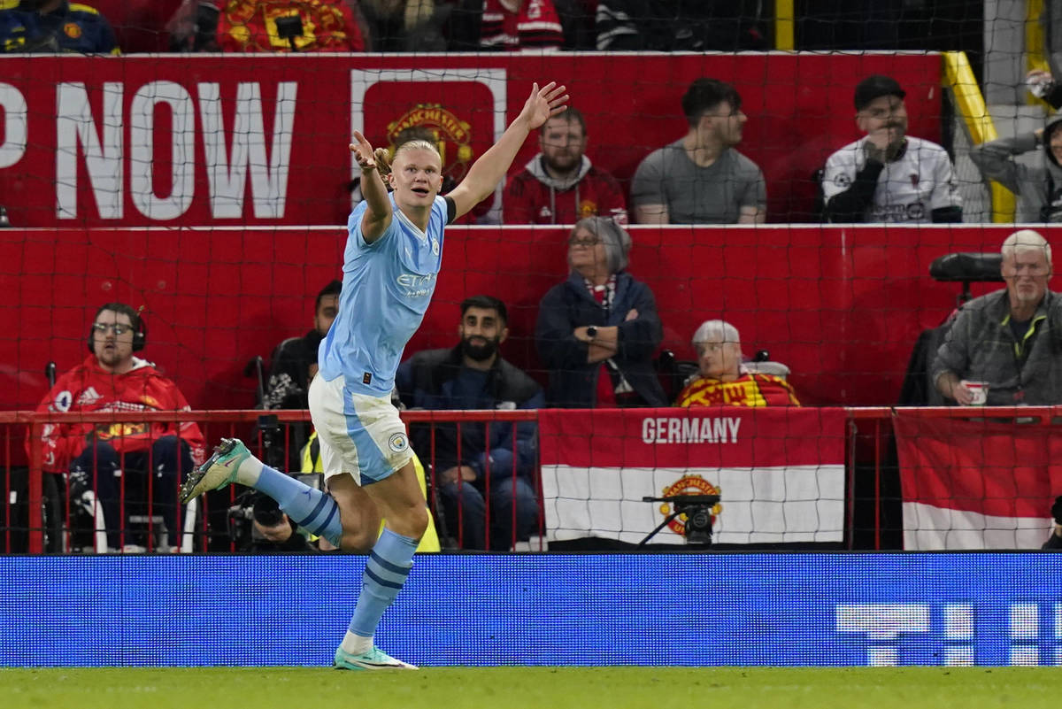 Manchester City striker Erling Haaland pictured celebrating after scoring the 20th away goal of his EPL career during a game against Manchester United in October 2023
