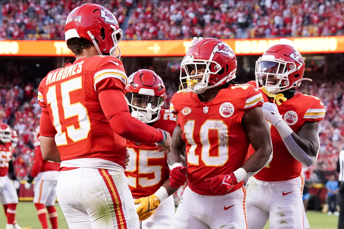 Kansas City Chiefs running back Isiah Pacheco (10) celebrates with quarterback Patrick Mahomes (15) after scoring a touchdown against the Los Angeles Chargers during the second half at GEHA Field at Arrowhead Stadium.