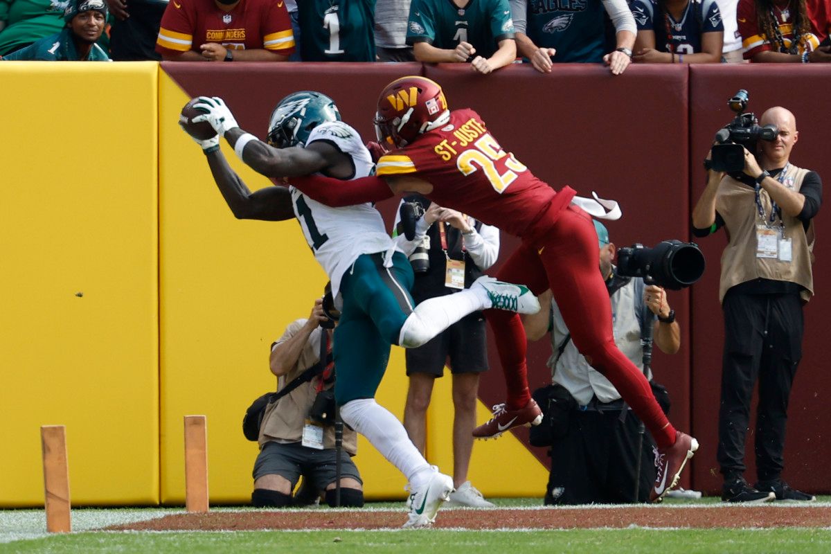 Philadelphia Eagles receiver A.J. Brown catches a touchdown against Washington Commanders cornerback Benjamin St-Juste.
