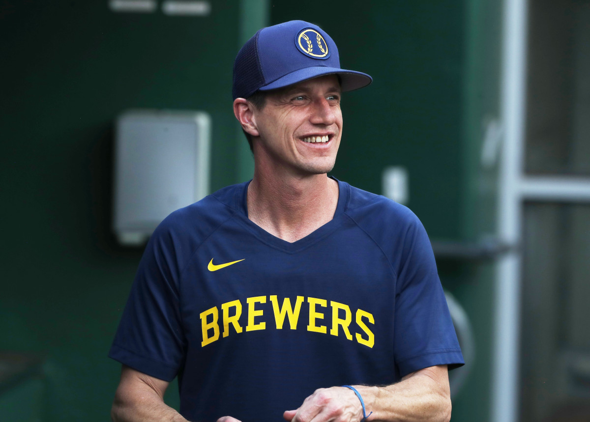 Sep 5, 2023; Pittsburgh, Pennsylvania, USA; Milwaukee Brewers manager Craig Counsell (30) smiles from the dugout during batting practice before the game against the Pittsburgh Pirates at PNC Park.