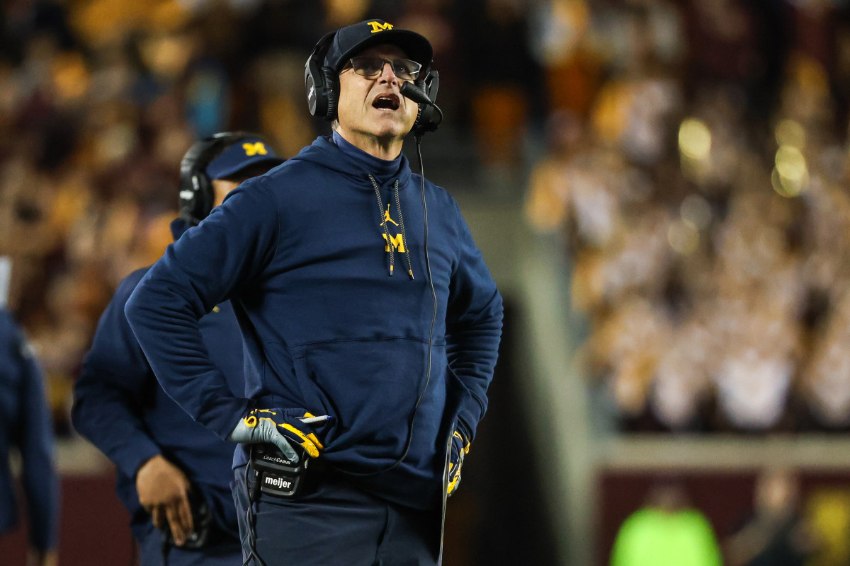 Michigan Wolverines head coach Jim Harbaugh looks on during the second quarter against the Minnesota Golden Gophers at Huntington Bank Stadium.