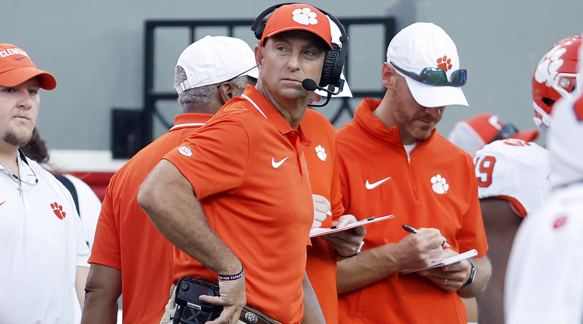 Clemson head coach Dabo Swinney watches a replay from the sideline during the second half against NC State.