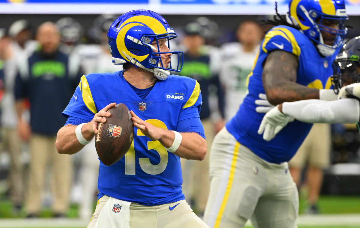 Dec 4, 2022; Inglewood, California, USA; Los Angeles Rams quarterback John Wolford (13) sets to pass in the first half against the Seattle Seahawks at SoFi Stadium.  