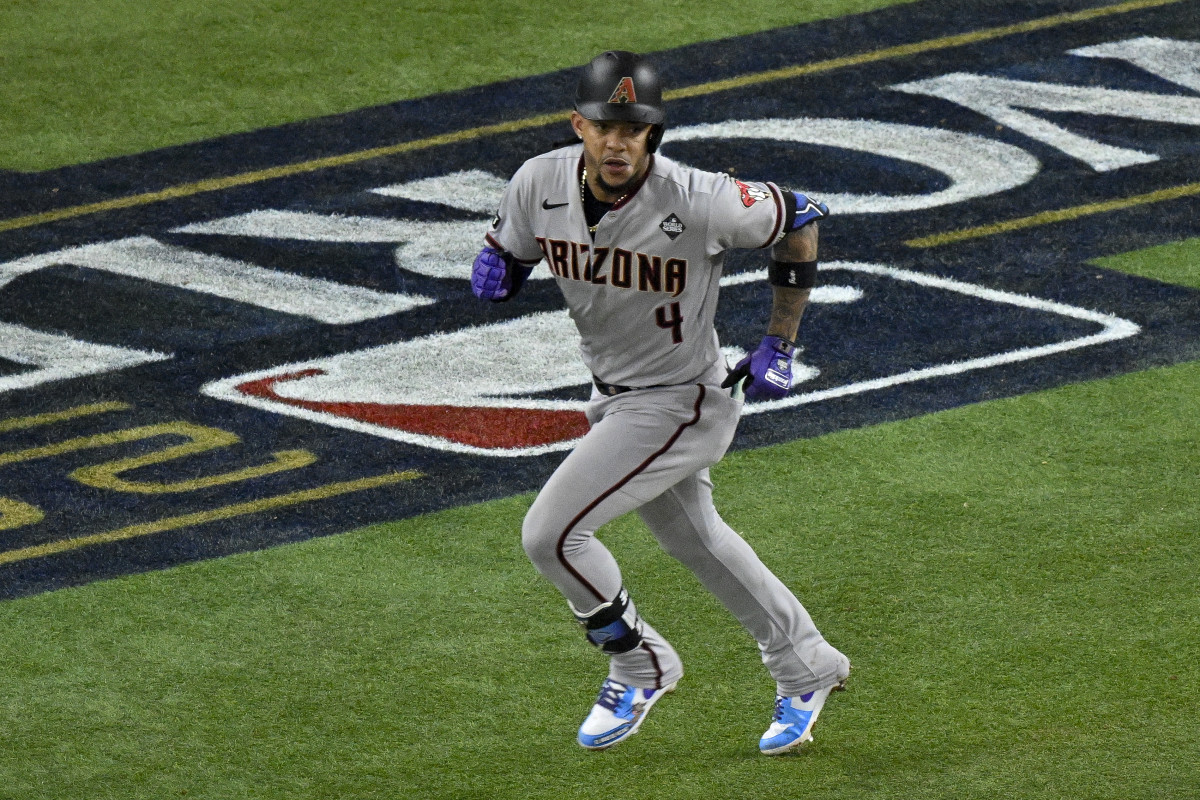 Oct 28, 2023; Arlington, Texas, USA; Arizona Diamondbacks second baseman Ketel Marte (4) hits a single and drives in two runs against the Texas Rangers during the eighth inning in game two of the 2023 World Series at Globe Life Field. Mandatory Credit: Jerome Miron-USA TODAY Sports