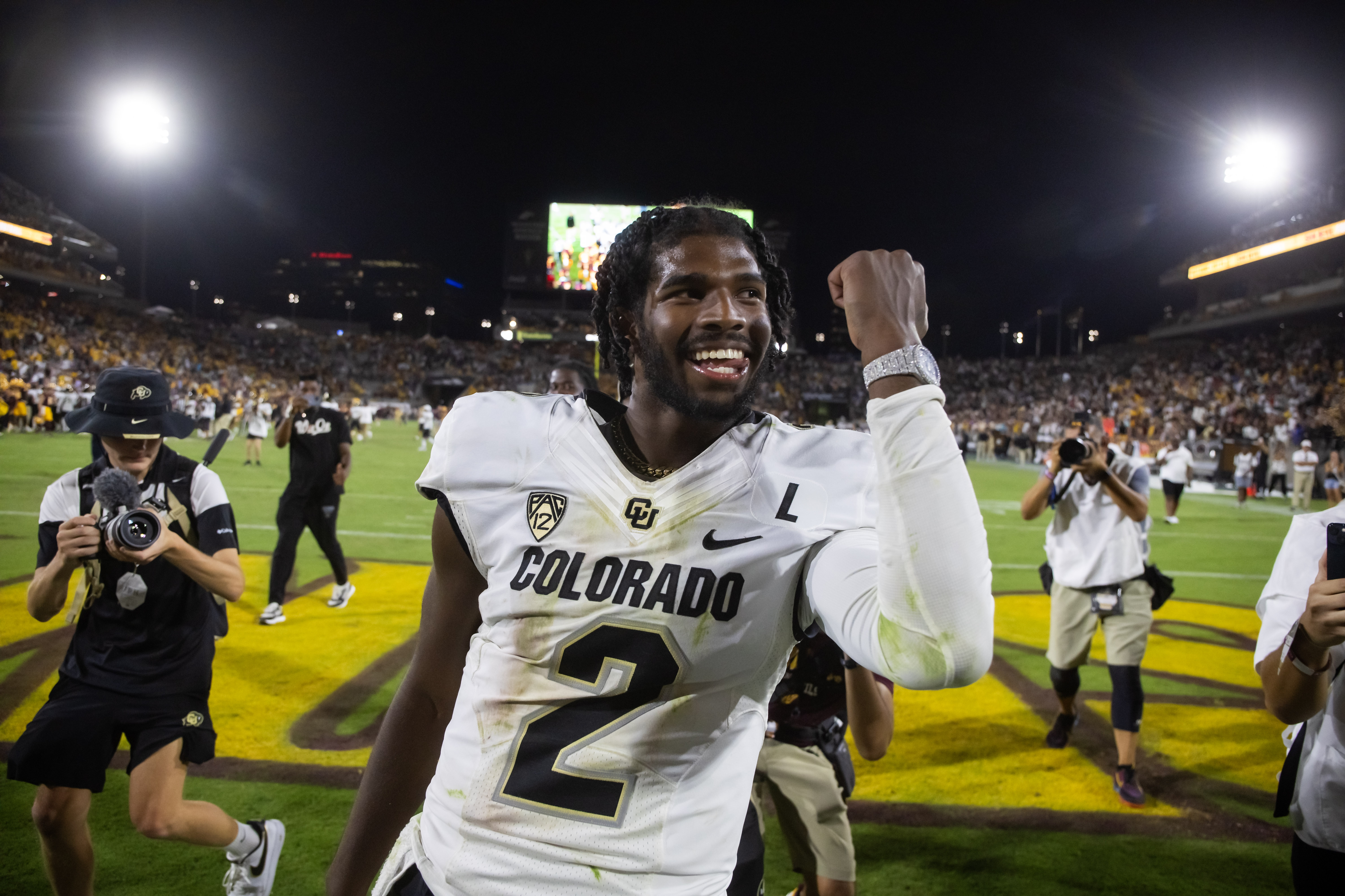 Colorado Buffaloes quarterback Shedeur Sanders (2) celebrates after defeating the Arizona State Sun Devils at Mountain America Stadium, Home of the ASU Sun Devils