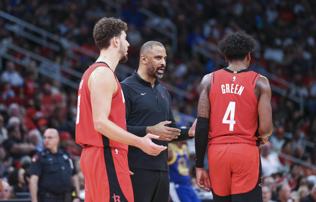 Rockets head coach Ime Udoka talks with center Alperen Sengun and guard Jalen Green (4) during the game against the Golden State Warriors at Toyota Center.