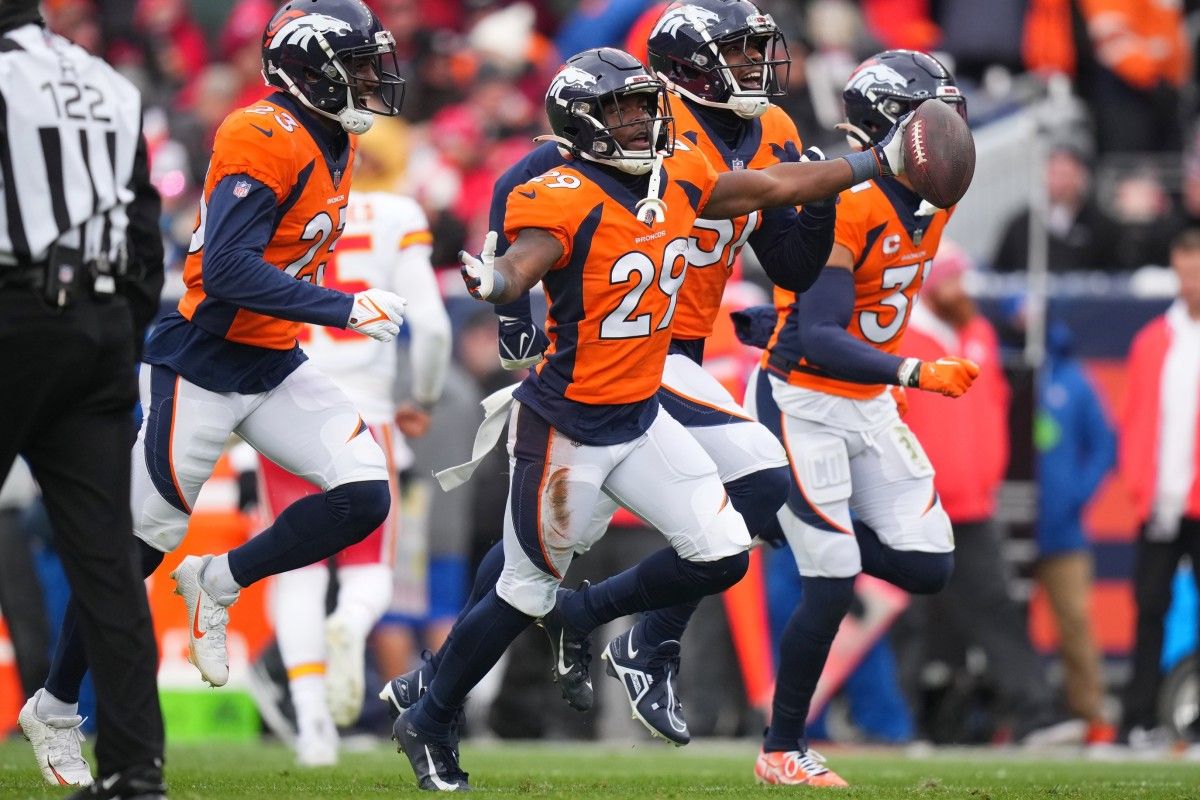 Denver Broncos cornerback Ja'Quan McMillian (29) celebrates his interception in the second quarter against the Kansas City Chiefs at Empower Field at Mile High.