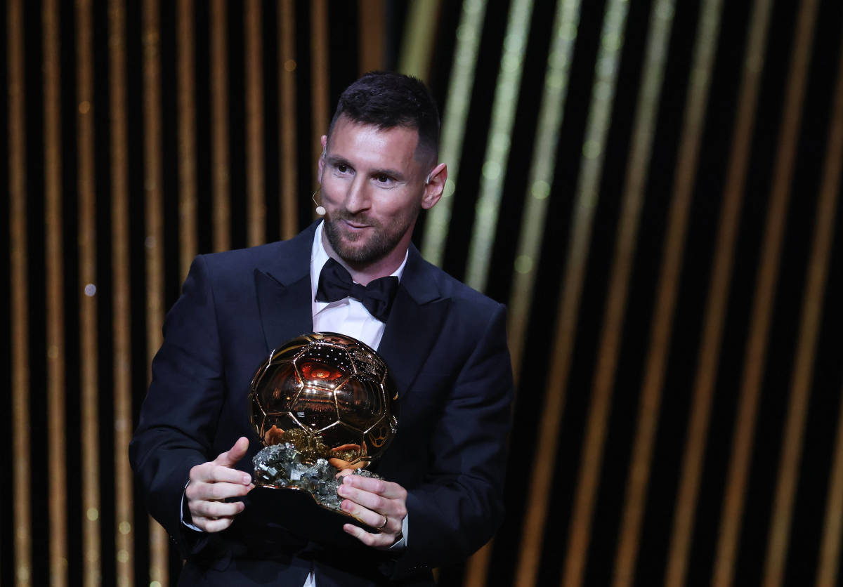 Lionel Messi pictured in October 2023 holding the Ballon d'Or trophy after winning the award for the eighth time