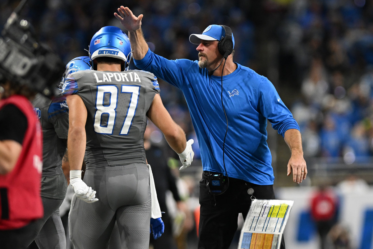 Detroit Lions head coach Dan Campbell congratulates tight end Sam LaPorta (87) after LaPorta caught a touchdown pass against the Las Vegas Raiders in the second quarter at Ford Field.