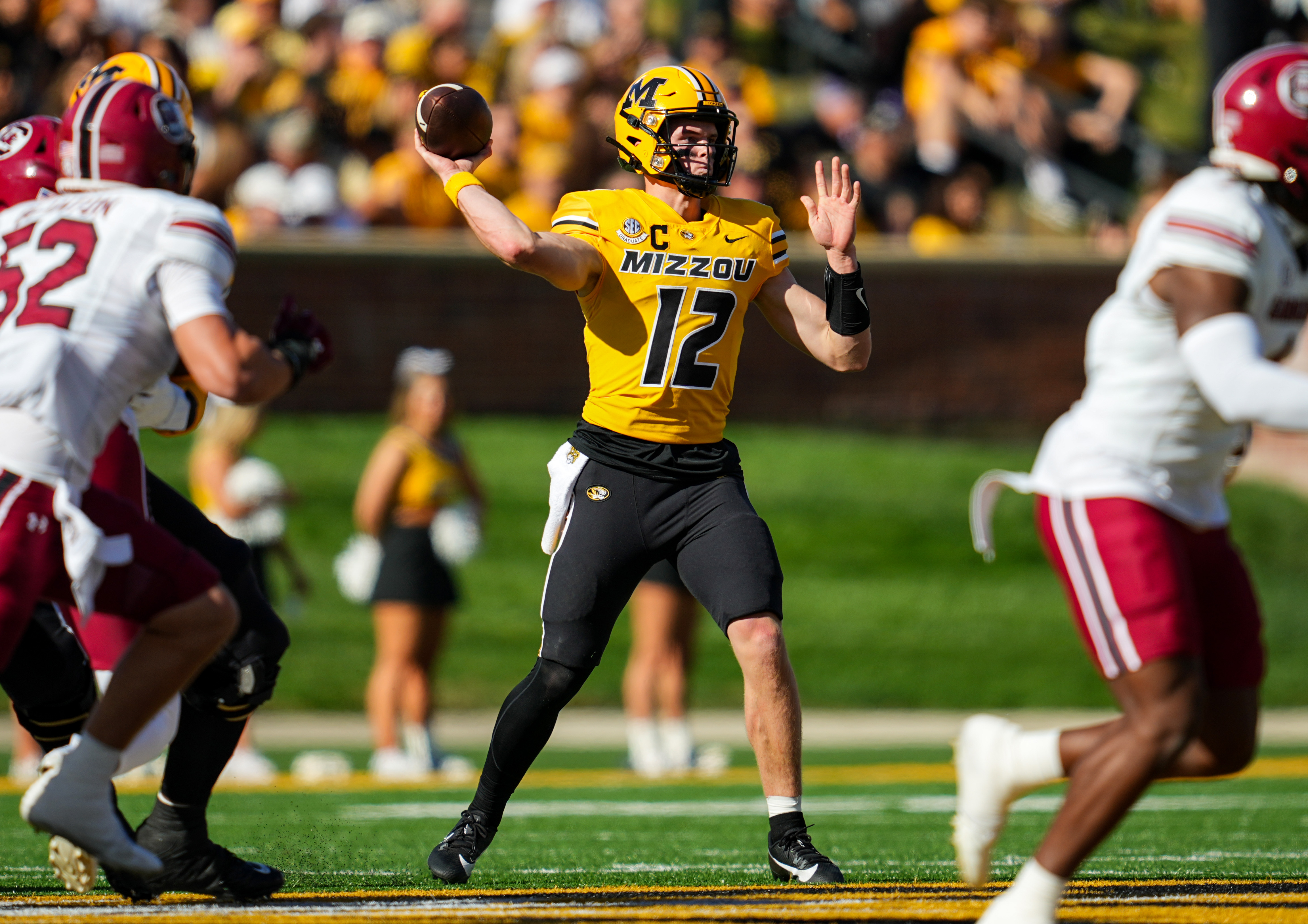 Oct 21, 2023; Columbia, Missouri, USA; Missouri Tigers quarterback Brady Cook (12) throws a pass against the South Crolina Gamecocks during the first half at Faurot Field at Memorial Stadium. (Jay Biggerstaff / USA TODAY Sports)