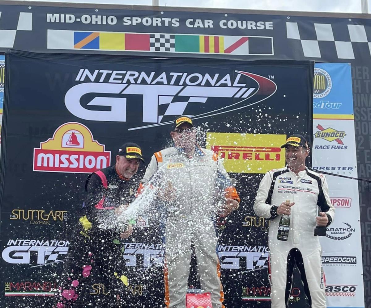 Mark Mathys (in middle of photo, partly obscured by champagne spray), celebrates his win at his home track, Mid-Ohio Sports Car Course, earlier this year.. Photo courtesy Mark Mathys official Facebook page.